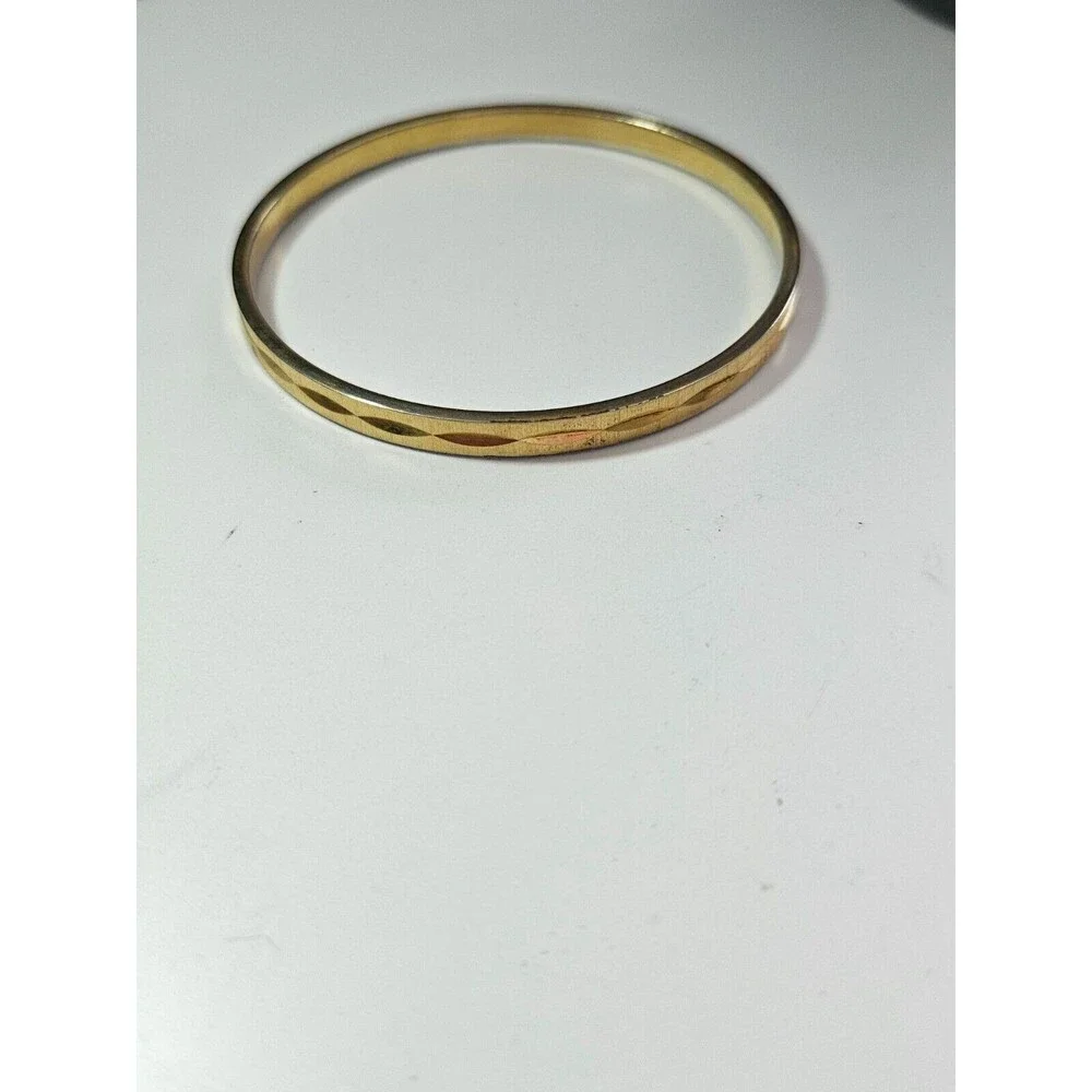 Monet gold tone diamond cut bangle bracelet 7.75